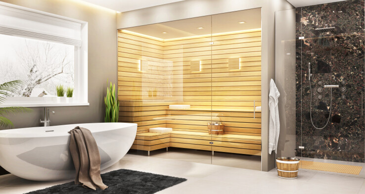 Sauna finlandais moderne dans la salle de bains, avec une baie vitrée, une baignoire îlot et une douche.
